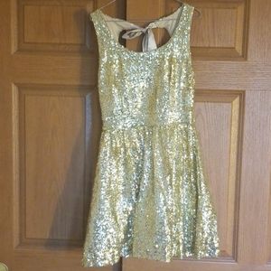 Short, gold-sequin dress